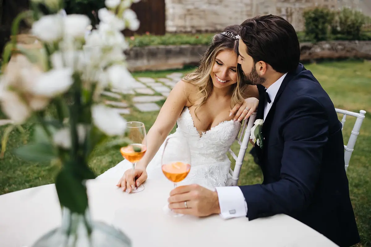 Guests and the couple sharing a natural, unposed moment at an Italian wedding reception.